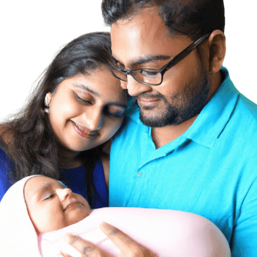 new parents smiling with their new born baby