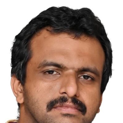 Dr Prasheen, doctor at Dofody, in a striped collared shirt
